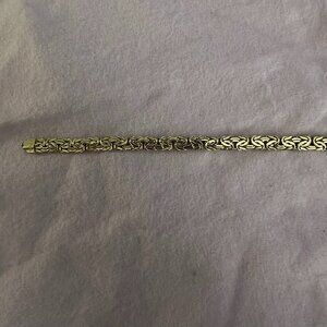 Solid 14Kt Gold Byzantine 7m wide 7 inches long bracelet.